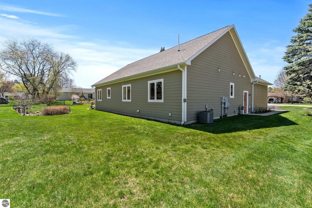 301 Pearl St, Kingsley, MI 49649 - view of property exterior featuring a yard and a shingled roof