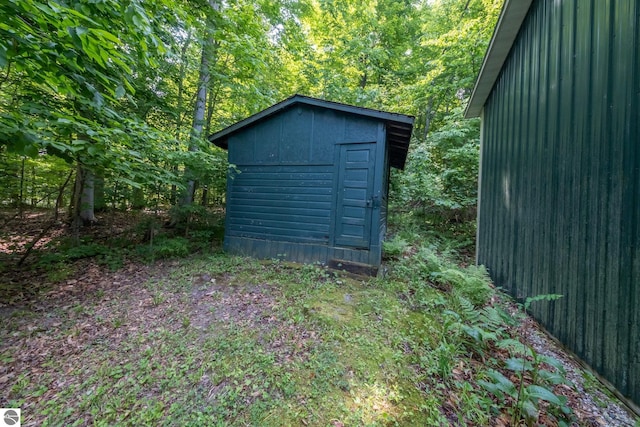 16530 Lonesome Trl, Leroy, MI 49655 - view of shed featuring a view of trees