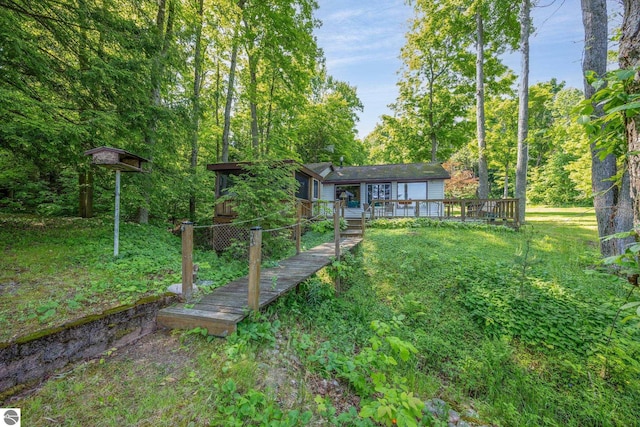 16530 Lonesome Trl, Leroy, MI 49655 - rear view of property featuring a wooden deck