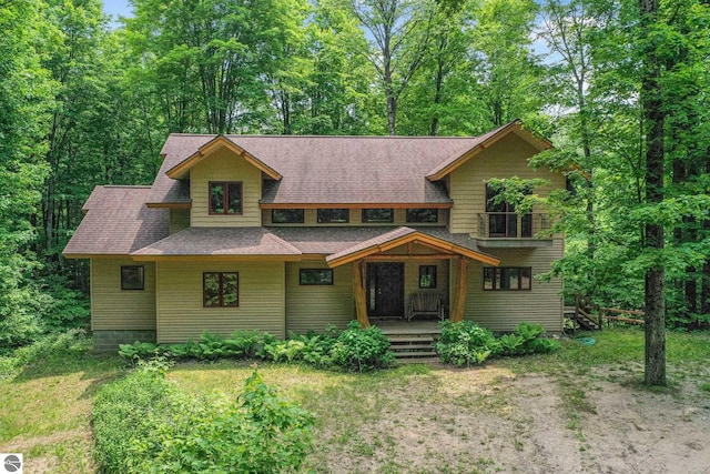 1849 W 24th Rd, Boon, MI 49618 - view of front facade with a shingled roof and covered porch