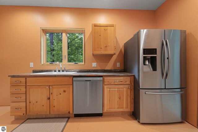 1849 W 24th Rd, Boon, MI 49618 - kitchen featuring stainless steel appliances, light brown cabinets, and dark countertops