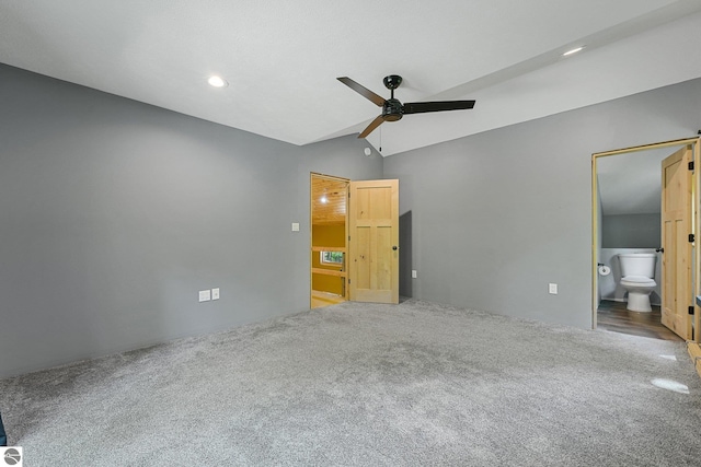 1849 W 24th Rd, Boon, MI 49618 - unfurnished bedroom with carpet, lofted ceiling, recessed lighting, connected bathroom, and ceiling fan