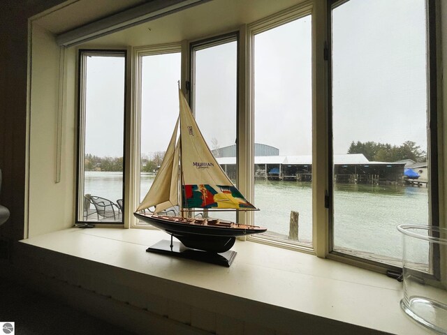 407 S Main St, Leland, MI 49654 - interior space featuring a water view and healthy amount of natural light