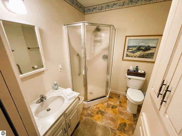 407 S Main St, Leland, MI 49654 - full bathroom with vanity, a stall shower, and stone finish flooring