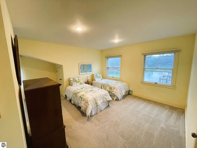 407 S Main St, Leland, MI 49654 - carpeted bedroom with baseboards and recessed lighting