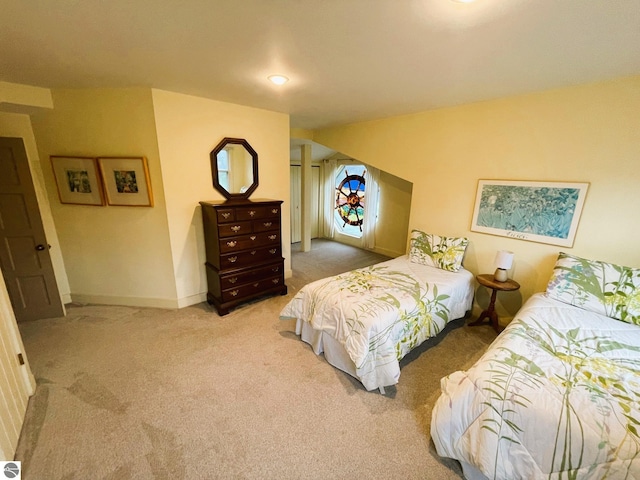 407 S Main St, Leland, MI 49654 - bedroom with carpet floors and baseboards