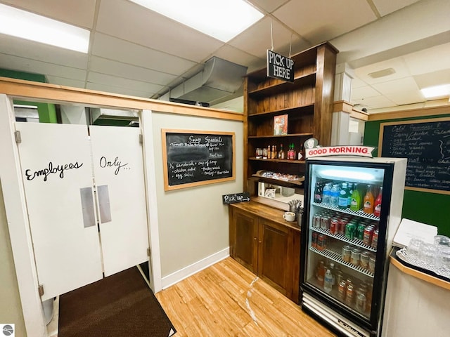 407 S Main St, Leland, MI 49654 - bar featuring a paneled ceiling and light wood finished floors