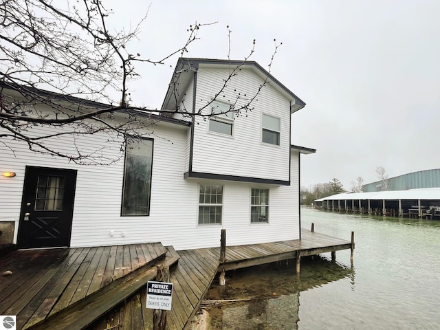 407 S Main St, Leland, MI 49654 - rear view of house featuring a water view