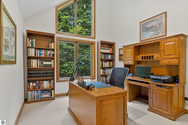 6352 S Westwood Pkwy, Suttons Bay, MI 49682 - home office with high vaulted ceiling and light colored carpet