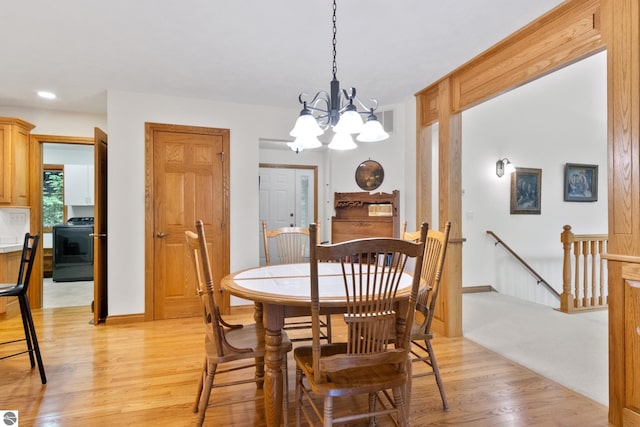 6352 S Westwood Pkwy, Suttons Bay, MI 49682 - dining space featuring light wood-type flooring, a chandelier, and recessed lighting