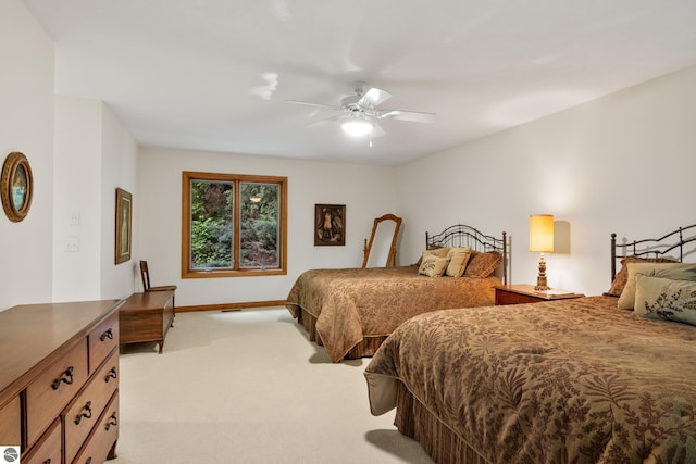 6352 S Westwood Pkwy, Suttons Bay, MI 49682 - bedroom with light colored carpet and a ceiling fan