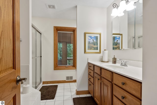 6352 S Westwood Pkwy, Suttons Bay, MI 49682 - full bathroom with vanity, a stall shower, and tile patterned flooring