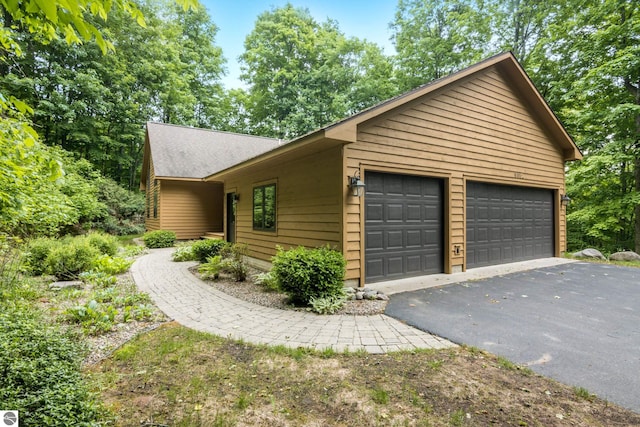 6352 S Westwood Pkwy, Suttons Bay, MI 49682 - view of side of home with a garage