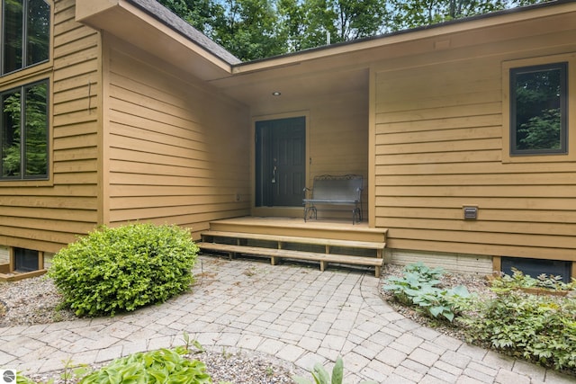 6352 S Westwood Pkwy, Suttons Bay, MI 49682 - view of exterior entry featuring a patio