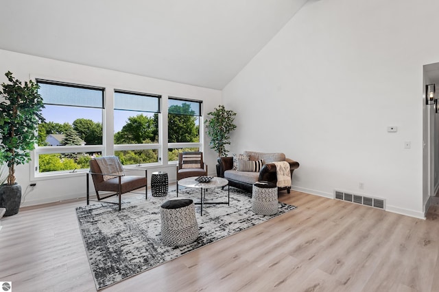 1259 Lin Dale Dr, Traverse City, MI 49686 - living room featuring high vaulted ceiling and wood finished floors