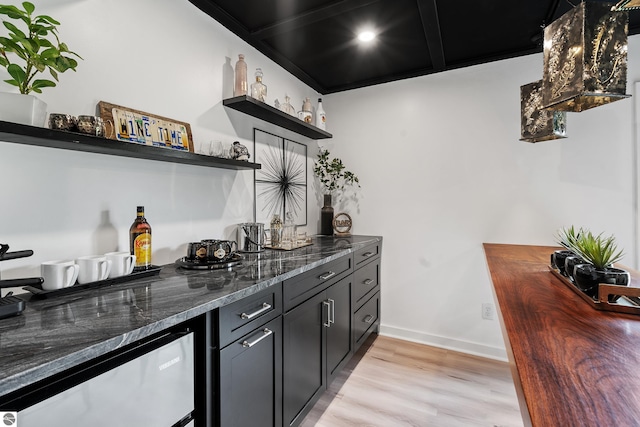 1259 Lin Dale Dr, Traverse City, MI 49686 - indoor dry bar featuring light wood finished floors and dishwasher