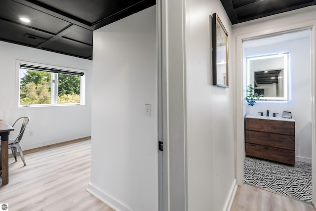 1259 Lin Dale Dr, Traverse City, MI 49686 - hallway featuring light wood-style flooring and baseboards