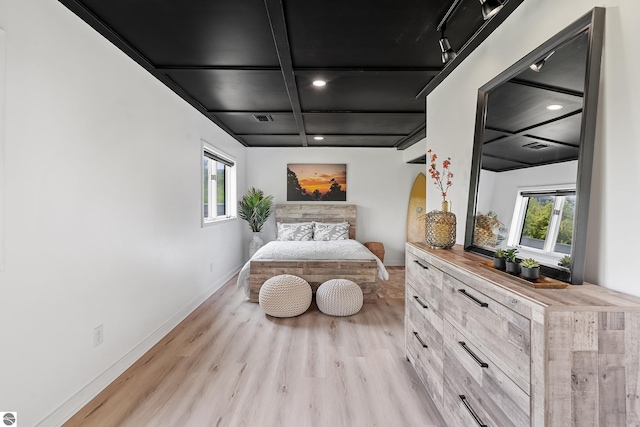 1259 Lin Dale Dr, Traverse City, MI 49686 - bedroom featuring coffered ceiling, light wood finished floors, multiple windows, recessed lighting, and beam ceiling