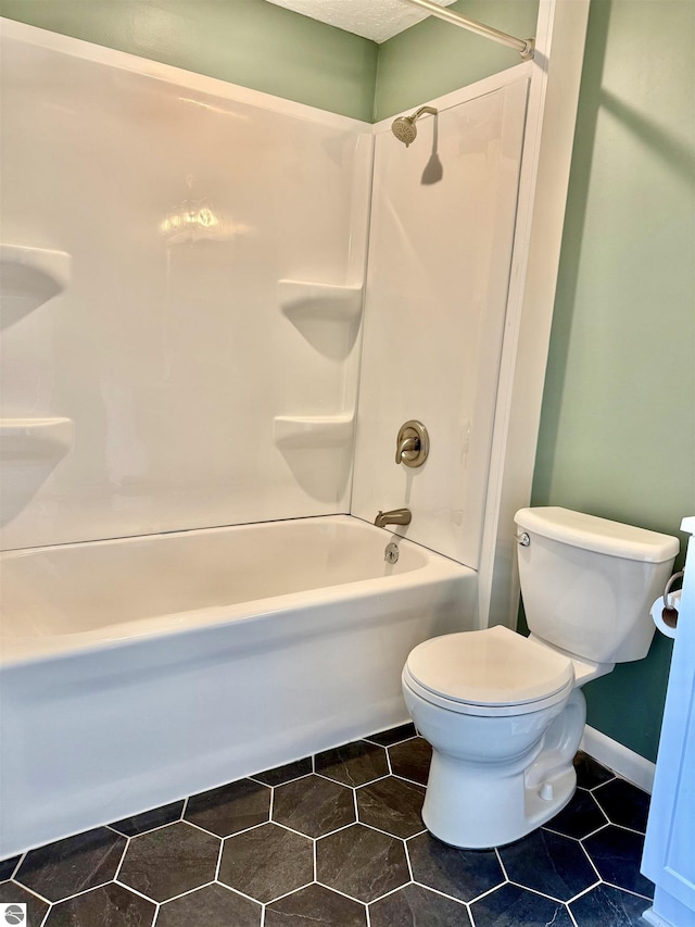 7160 Cherry Ave, Kewadin, MI 49648 - bathroom featuring bathtub / shower combination and tile patterned floors