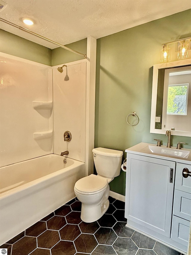 7160 Cherry Ave, Kewadin, MI 49648 - full bath with vanity, a textured ceiling, washtub / shower combination, and tile patterned floors