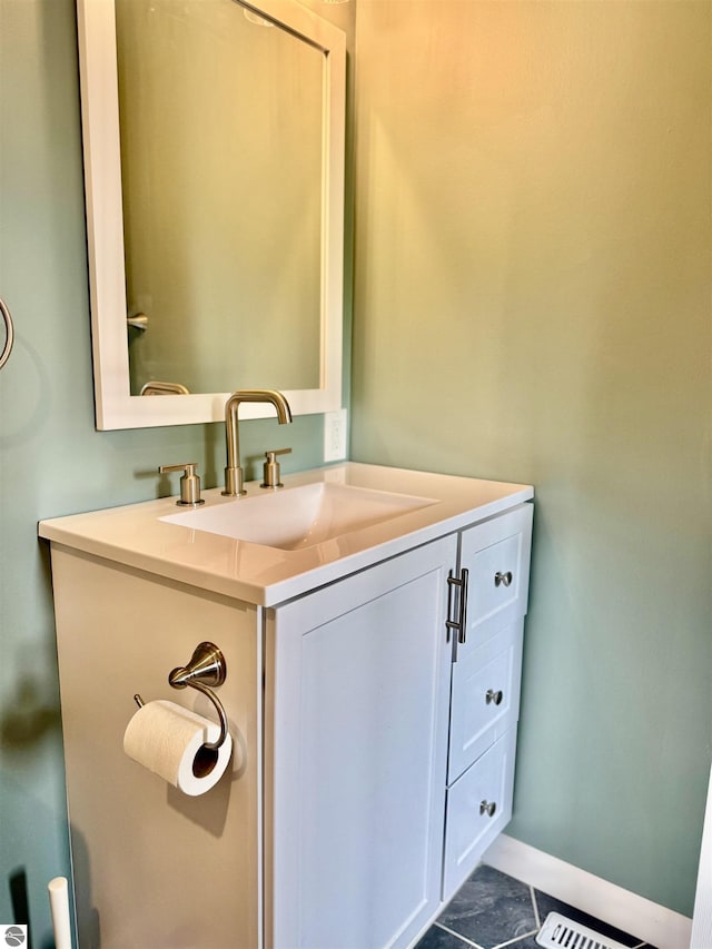 7160 Cherry Ave, Kewadin, MI 49648 - bathroom featuring vanity and tile patterned flooring