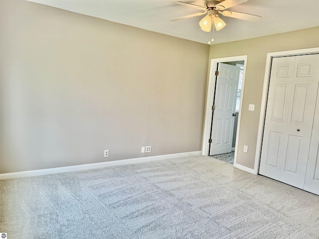 7160 Cherry Ave, Kewadin, MI 49648 - unfurnished bedroom with carpet floors, a closet, and ceiling fan