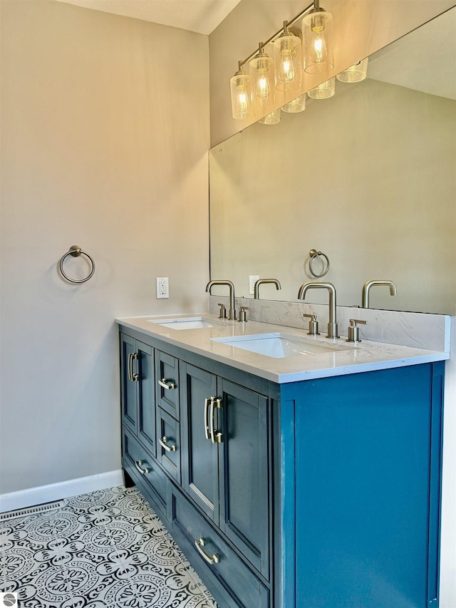7160 Cherry Ave, Kewadin, MI 49648 - bathroom featuring tile patterned floors and double vanity