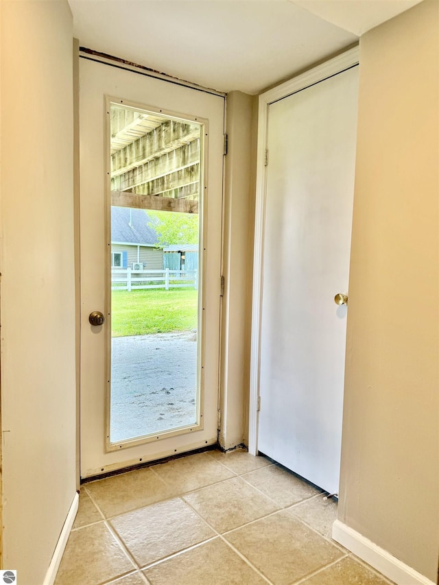 7160 Cherry Ave, Kewadin, MI 49648 - entryway featuring light tile patterned floors