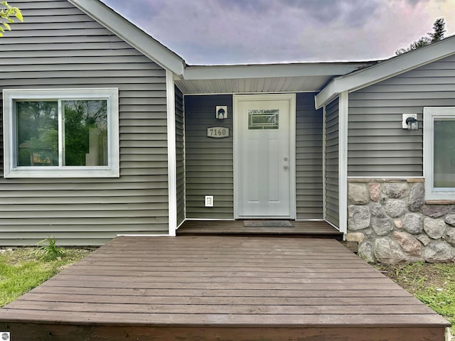 7160 Cherry Ave, Kewadin, MI 49648 - view of exterior entry featuring stone siding