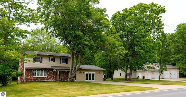 10200 S Lake Station Ave, Lake, MI 48632 - view of front of property featuring french doors, a front yard, and brick siding