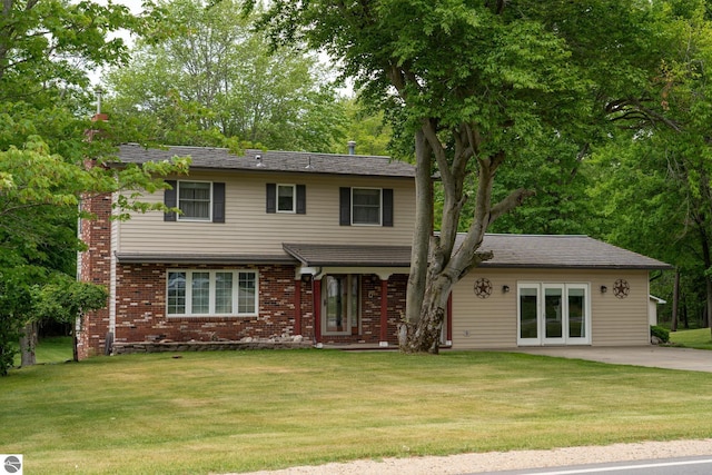 10200 S Lake Station Ave, Lake, MI 48632 - traditional home with a front yard and brick siding