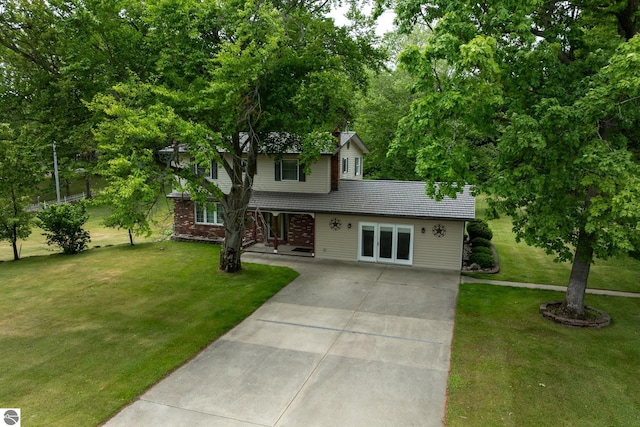 10200 S Lake Station Ave, Lake, MI 48632 - view of front of property with driveway, a front yard, and french doors