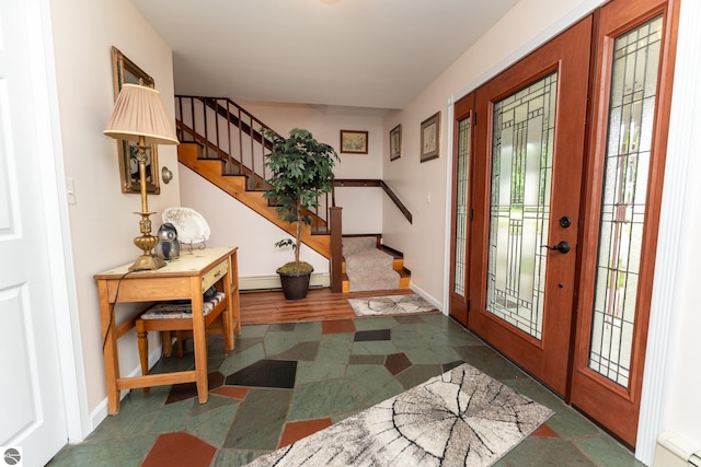 10200 S Lake Station Ave, Lake, MI 48632 - entrance foyer featuring stairway and a baseboard heating unit