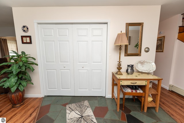 10200 S Lake Station Ave, Lake, MI 48632 - foyer entrance with baseboards and a baseboard heating unit