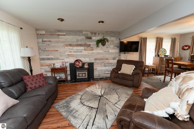 10200 S Lake Station Ave, Lake, MI 48632 - living room featuring wood finished floors and a wood stove