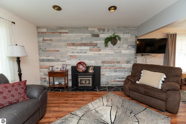 10200 S Lake Station Ave, Lake, MI 48632 - living room with wood finished floors and a wood stove