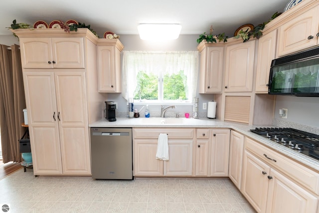 10200 S Lake Station Ave, Lake, MI 48632 - kitchen with appliances with stainless steel finishes, light brown cabinetry, and light countertops