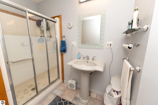 10200 S Lake Station Ave, Lake, MI 48632 - bathroom featuring a stall shower and baseboards