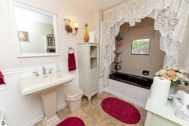 10200 S Lake Station Ave, Lake, MI 48632 - full bath with a wainscoted wall and shower / bath combination