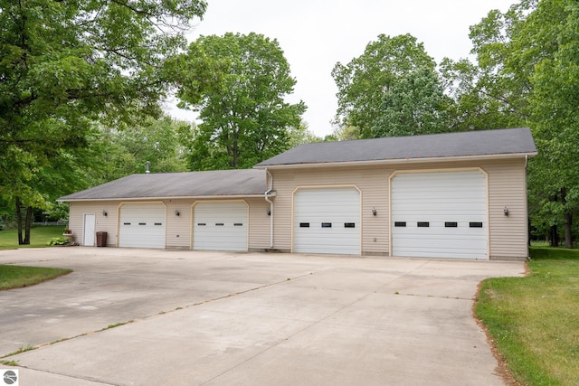 10200 S Lake Station Ave, Lake, MI 48632 - detached garage featuring view of wooded area