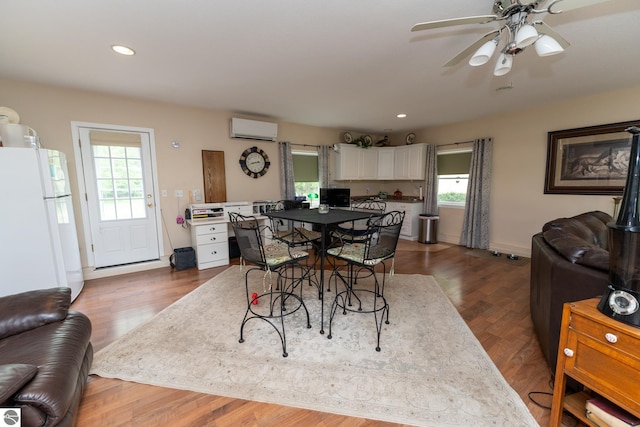 10200 S Lake Station Ave, Lake, MI 48632 - dining area featuring a wall unit AC, recessed lighting, a ceiling fan, and dark wood-style flooring