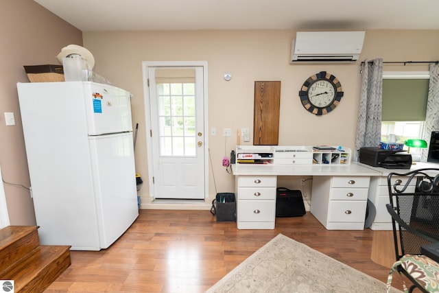 10200 S Lake Station Ave, Lake, MI 48632 - office area featuring a wall mounted AC and wood finished floors