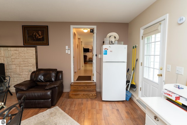 10200 S Lake Station Ave, Lake, MI 48632 - living area featuring light wood-style flooring and baseboards