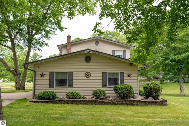10200 S Lake Station Ave, Lake, MI 48632 - view of front of property with a front yard and a chimney