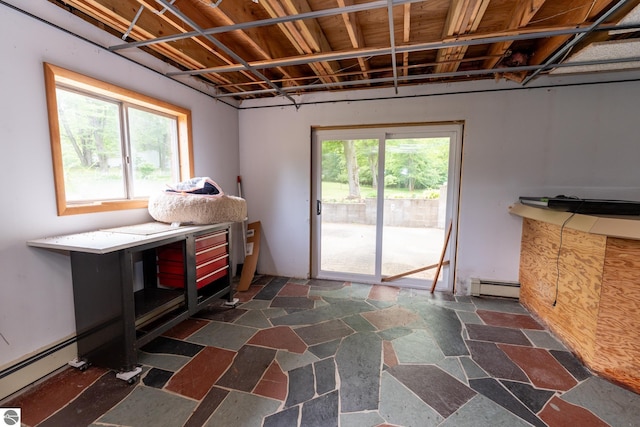 10200 S Lake Station Ave, Lake, MI 48632 - miscellaneous room with a baseboard radiator and dark stone finish flooring