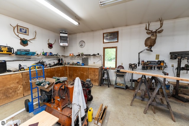 10200 S Lake Station Ave, Lake, MI 48632 - kitchen with brown cabinetry, concrete flooring, and a heating unit