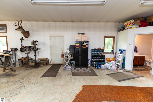 10200 S Lake Station Ave, Lake, MI 48632 - garage with black fridge