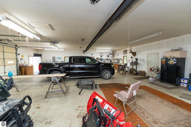 10200 S Lake Station Ave, Lake, MI 48632 - garage featuring black fridge