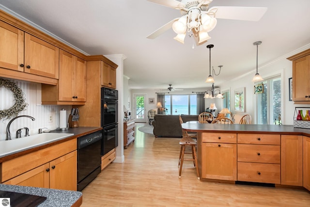 589 Pine Ln, East Tawas, MI 48730 - kitchen featuring black appliances, a ceiling fan, light wood finished floors, open floor plan, and ornamental molding