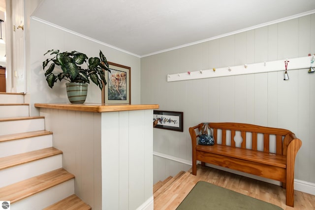 589 Pine Ln, East Tawas, MI 48730 - stairway with wood finished floors and crown molding